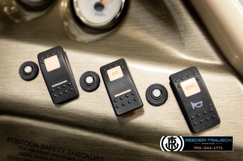 Slide: The Image of Dashboard controls of a 2004 Smoker Craft 820 Infinity Cruise boat. - 32