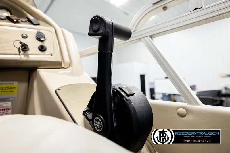 Slide: The Image of Throttle control of 2004 Smoker Craft 820 Infinity Cruise boat in a showroom. - 34