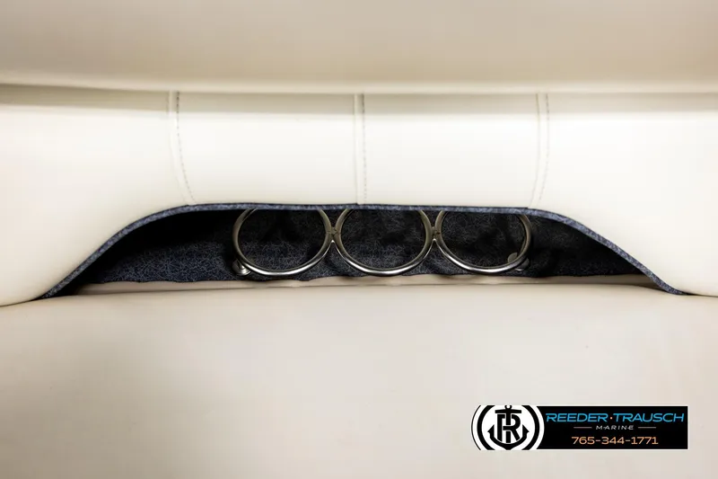 Slide: The Image of Cup holders in white leather seating of 2004 Smoker Craft 820 Infinity Cruise boat. - 38