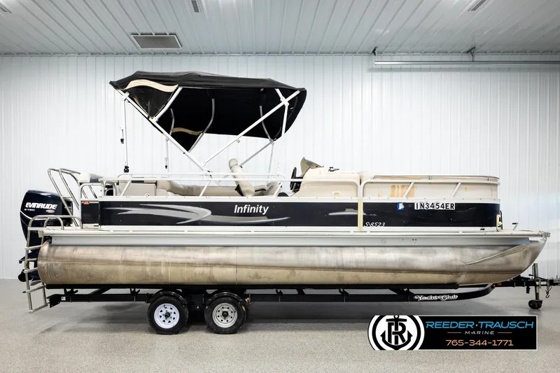 Slide: The Image of 2004 Smoker Craft 820 Infinity Cruise pontoon boat with canopy in indoor showroom. - 5