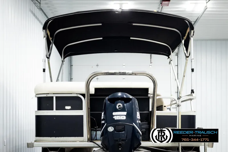 Slide: The Image of 2004 Smoker Craft 820 Infinity Cruise pontoon boat with canopy and Evinrude motor. - 7