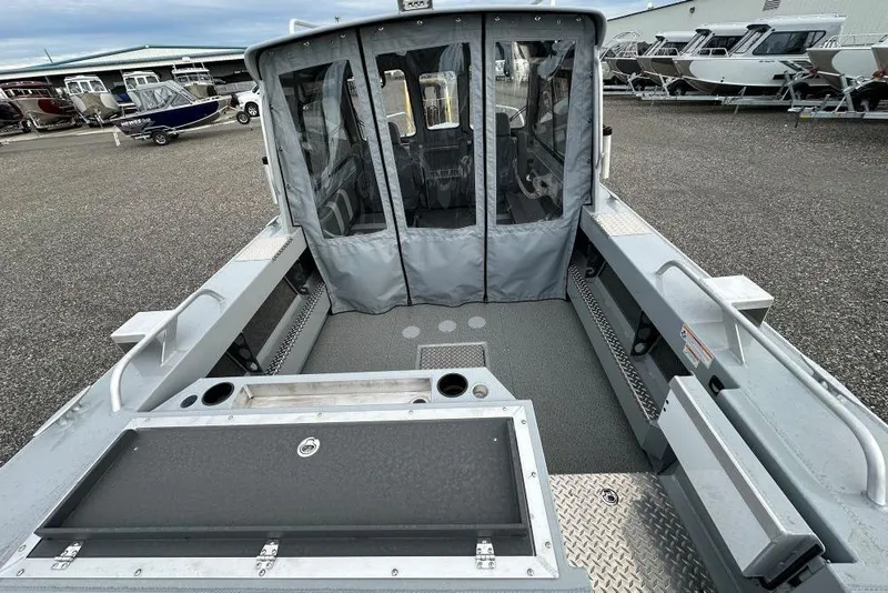 Slide: The Image of 2026 Hewescraft 190 Sea Runner Hardtop boat interior with covered cabin and seating. - 5