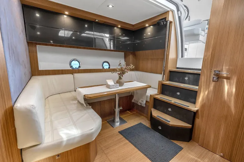 Slide: The Image of Luxurious interior of 2014 Azimut Atlantis 48 yacht with elegant seating and wooden finishes. - 11