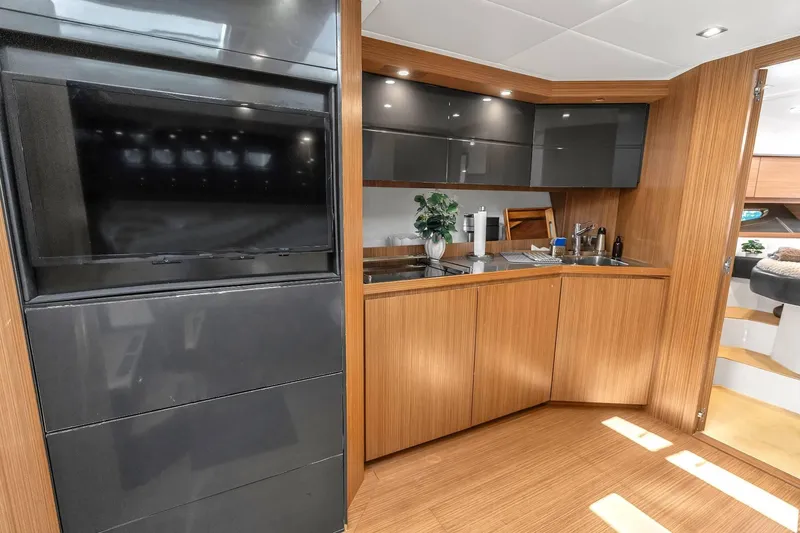 Slide: The Image of Luxurious interior of 2014 Azimut Atlantis 48 yacht with modern kitchen and sleek design. - 12