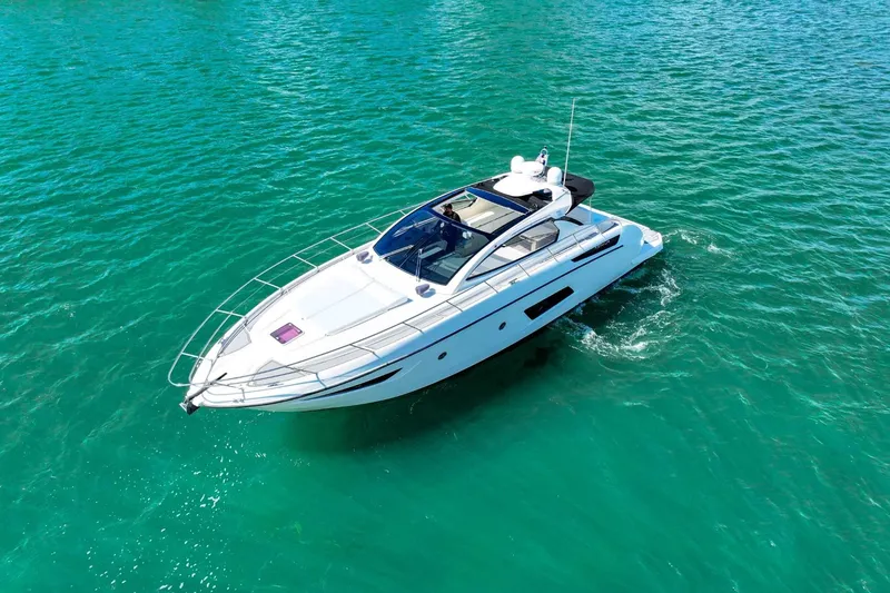 Slide: The Image of 2014 Azimut Atlantis 48 yacht cruising on clear turquoise waters. - 3