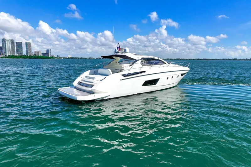 Slide: The Image of 2014 Azimut Atlantis 48 yacht cruising on clear blue waters under a sunny sky. - 4