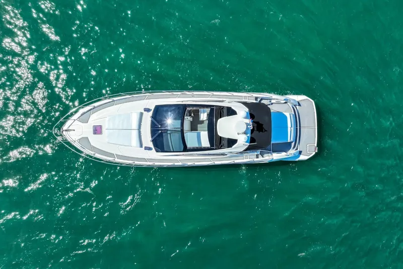 Slide: The Image of Overhead view of 2014 Azimut Atlantis 48 yacht on turquoise water. - 5