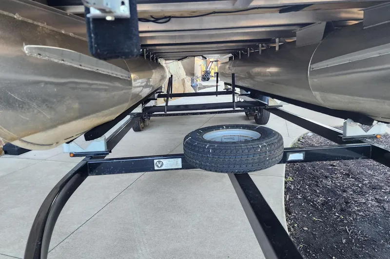 Slide: The Image of Underneath view of a 2018 Bennington SX22 pontoon boat on a trailer. - 12
