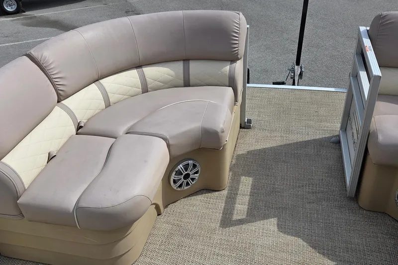 Slide: The Image of 2018 Bennington SX22 boat interior with beige seating and speaker. - 6