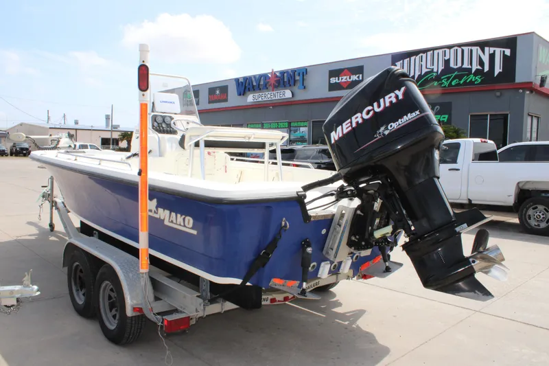 Slide: The Image of 2008 Mako 2201 Tunnel Inshore boat with Mercury engine on trailer. - 3