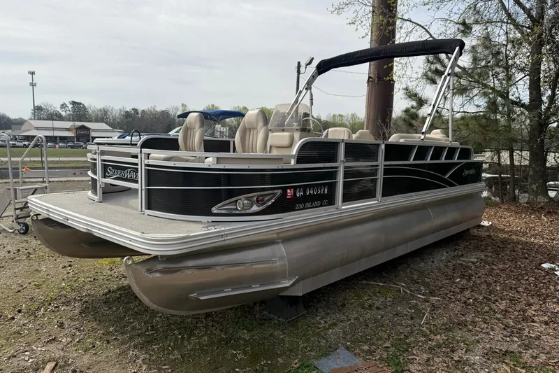 The Image of 2016 SilverWave 230 Island CC pontoon boat parked on grassy area. - 1