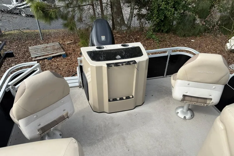 Slide: The Image of 2016 SilverWave 230 Island CC boat interior with seating and console. - 12