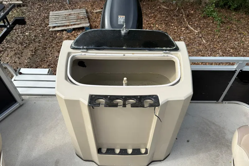 Slide: The Image of Open storage compartment on 2016 SilverWave 230 Island CC boat deck. - 14