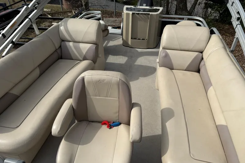 Slide: The Image of Interior of a 2016 SilverWave 230 Island CC boat with beige seating. - 9