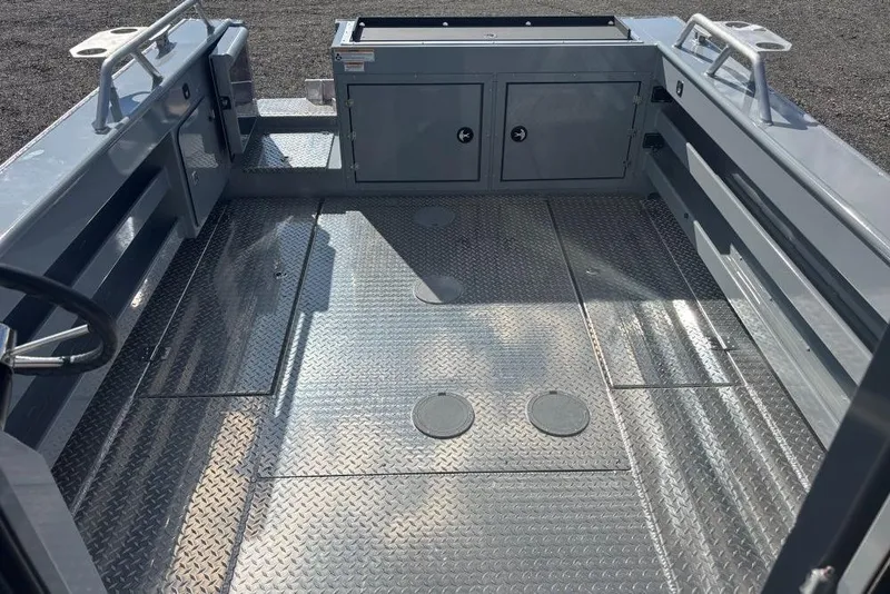 Slide: The Image of 2026 Hewescraft 250 Alaskan boat interior with diamond plate flooring and storage compartments. - 4