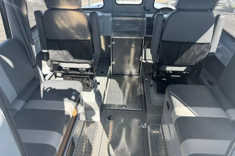 Slide: The Image of Interior of 2026 Hewescraft 250 Alaskan boat with seating and storage. - 5