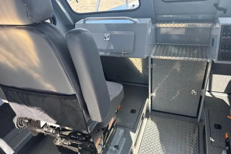 Slide: The Image of Interior of 2026 Hewescraft 250 Alaskan boat, featuring seating and storage compartments. - 7