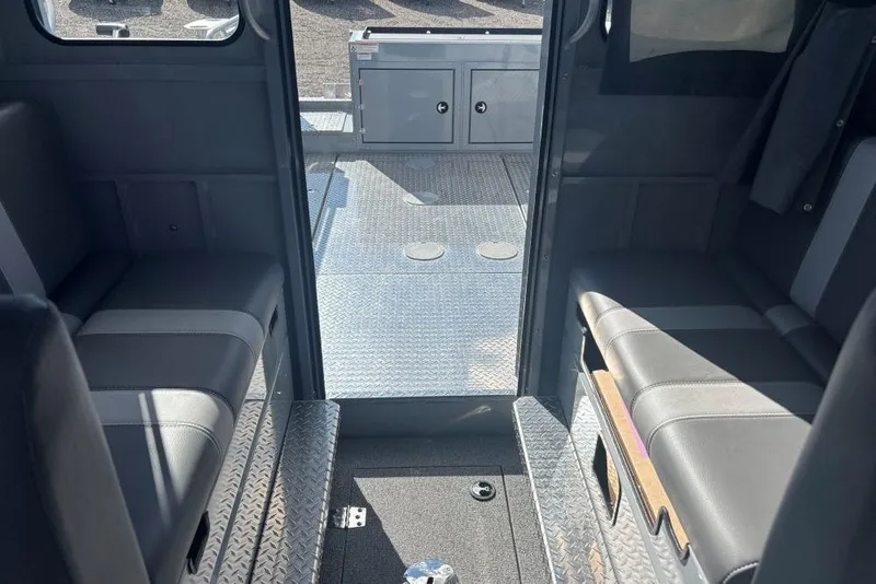 Slide: The Image of Interior view of 2026 Hewescraft 250 Alaskan boat with seating and storage. - 8