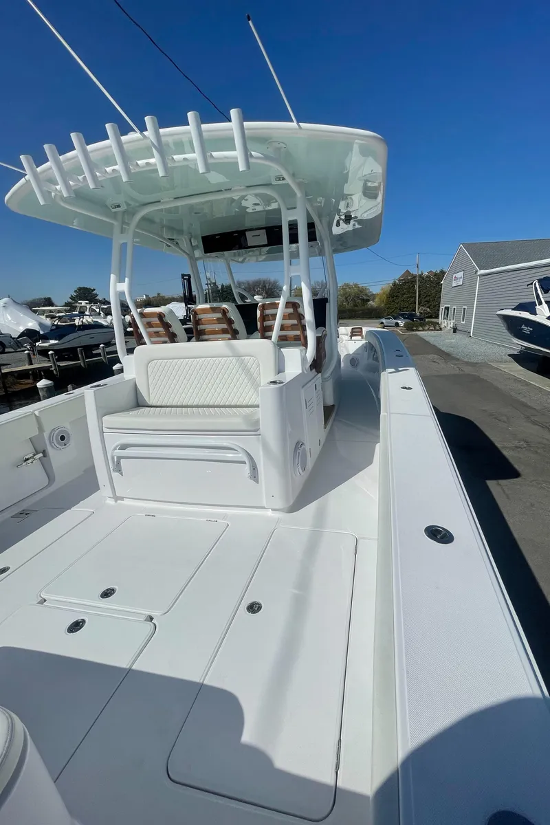 Slide: The Image of 2023 Jupiter 40 boat with spacious deck and modern seating. - 10