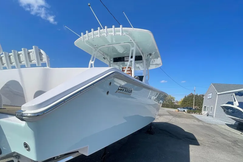 Slide: The Image of 2023 Jupiter 40 boat on display under clear blue sky. - 2