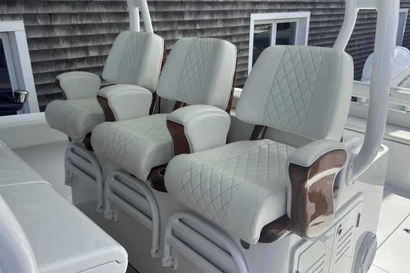 Slide: The Image of Luxurious white leather boat seats with diamond stitching on a 2023 Jupiter 40 model. - 32