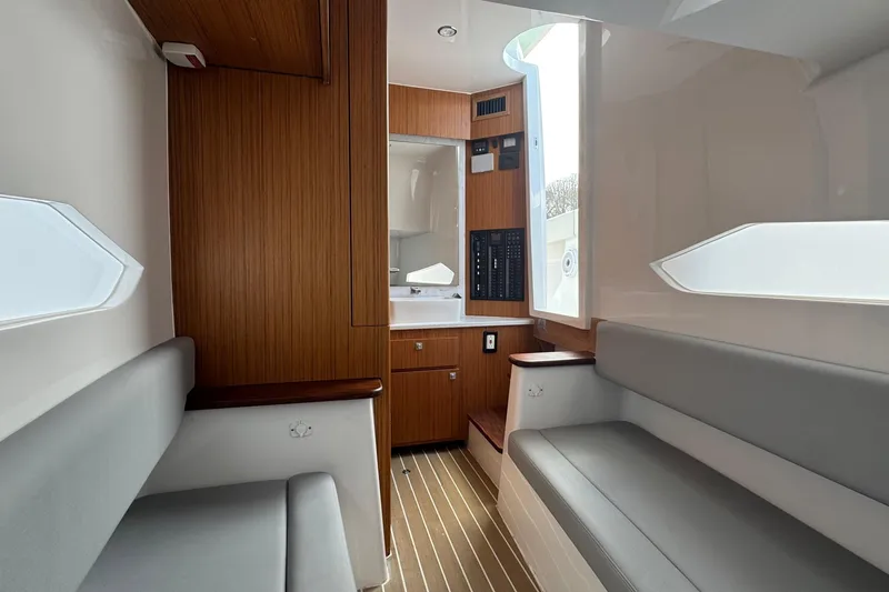 Slide: The Image of Modern interior of 2023 Jupiter 40 boat with wood paneling and seating. - 38