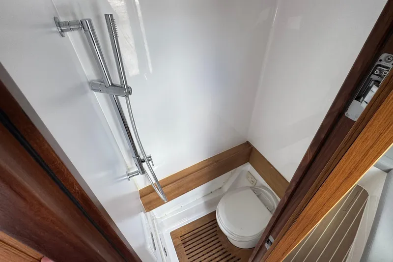 Slide: The Image of Compact bathroom in 2023 Jupiter 40 boat with shower and toilet. - 39