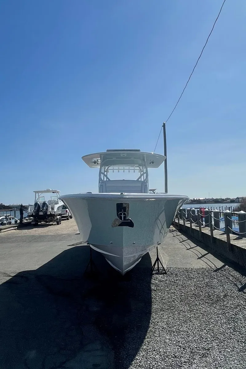 Slide: The Image of 2023 Jupiter 40 boat docked under clear blue sky. - 4