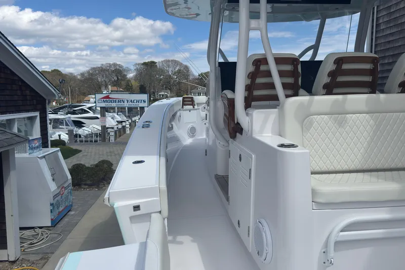 Slide: The Image of 2023 Jupiter 40 boat at Modern Yachts dealership, showcasing sleek design and seating. - 41