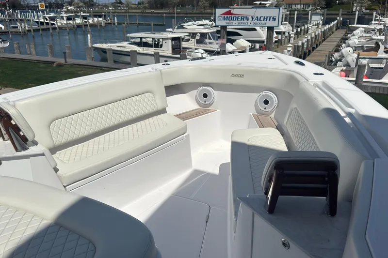 Slide: The Image of Luxurious seating area on a 2023 Jupiter 40 yacht at a marina. - 47