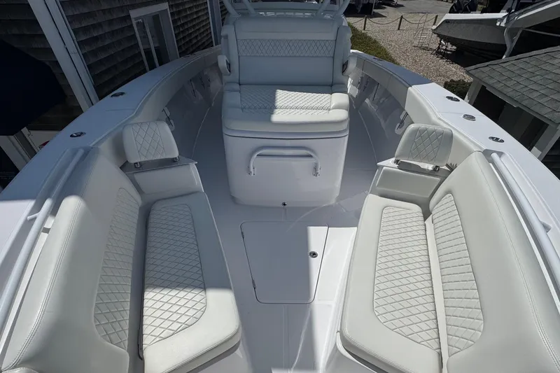 Slide: The Image of Luxurious seating area on a 2023 Jupiter 40 boat with quilted upholstery. - 49