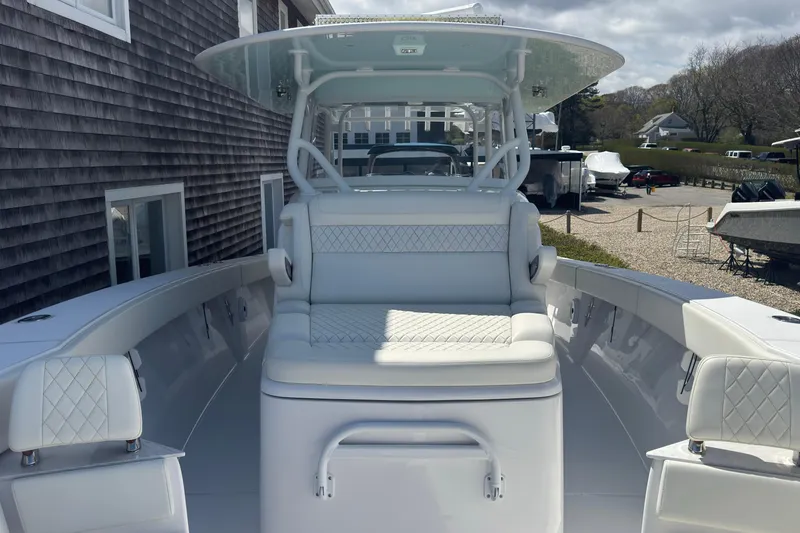 Slide: The Image of 2023 Jupiter 40 boat interior with cushioned seating and sleek design. - 50