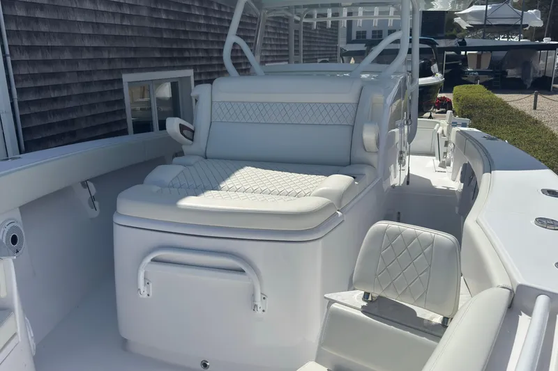 Slide: The Image of 2023 Jupiter 40 boat interior with luxurious white seating and modern design. - 52