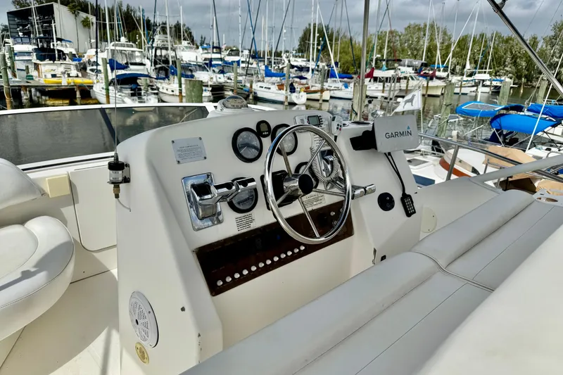 Slide: The Image of Cockpit of 2000 Silverton 322 Motor Yacht with Garmin navigation, docked at marina. - 13