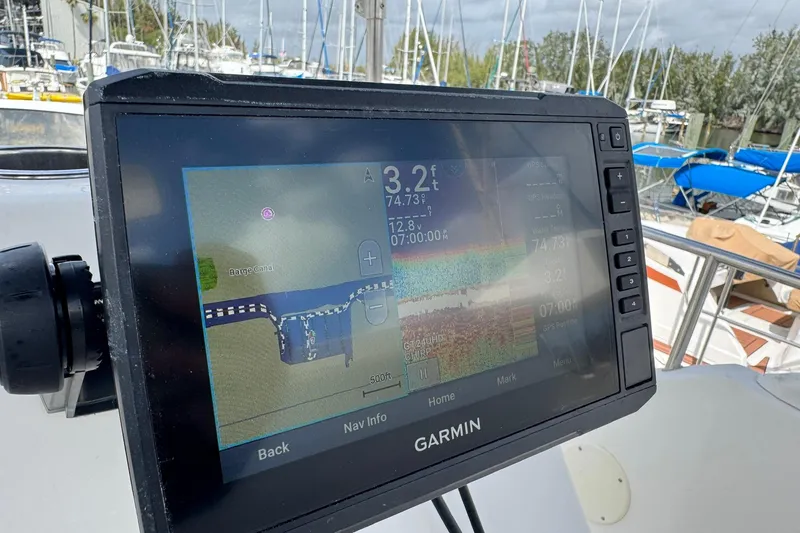 Slide: The Image of Garmin GPS display on 2000 Silverton 322 Motor Yacht, docked with sailboats in background. - 15