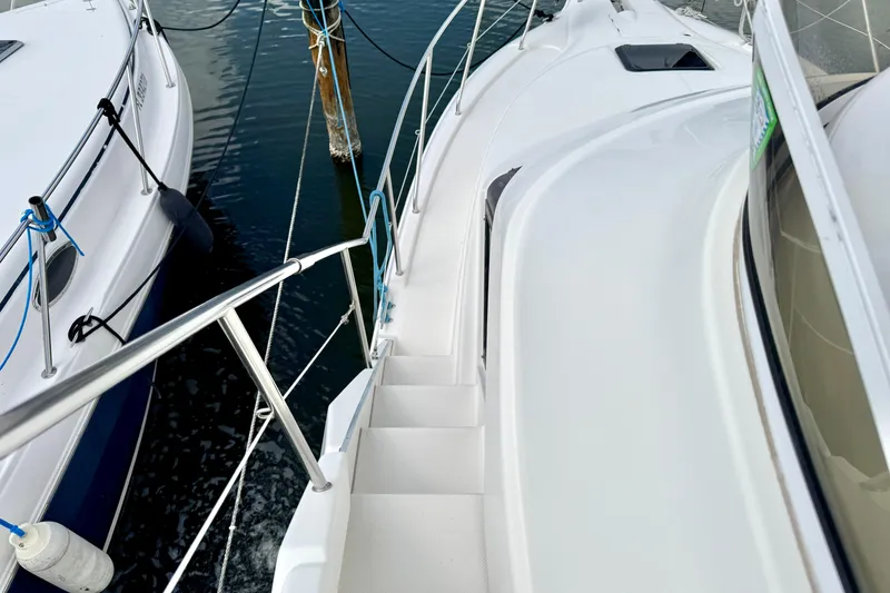 Slide: The Image of 2000 Silverton 322 Motor Yacht deck view with railing and water. - 17