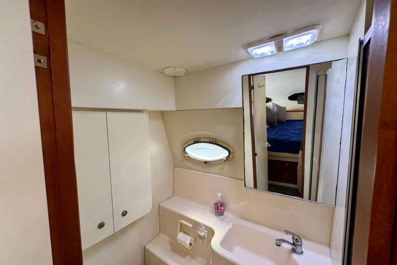 Slide: The Image of Bathroom interior of 2000 Silverton 322 Motor Yacht with sink and mirror. - 33