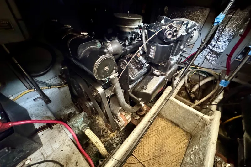 Slide: The Image of Engine compartment of a 2000 Silverton 322 Motor Yacht, showing detailed machinery and wiring. - 36
