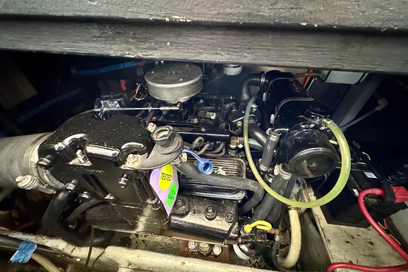 Slide: The Image of Engine compartment of a 2000 Silverton 322 Motor Yacht, showcasing mechanical components. - 37