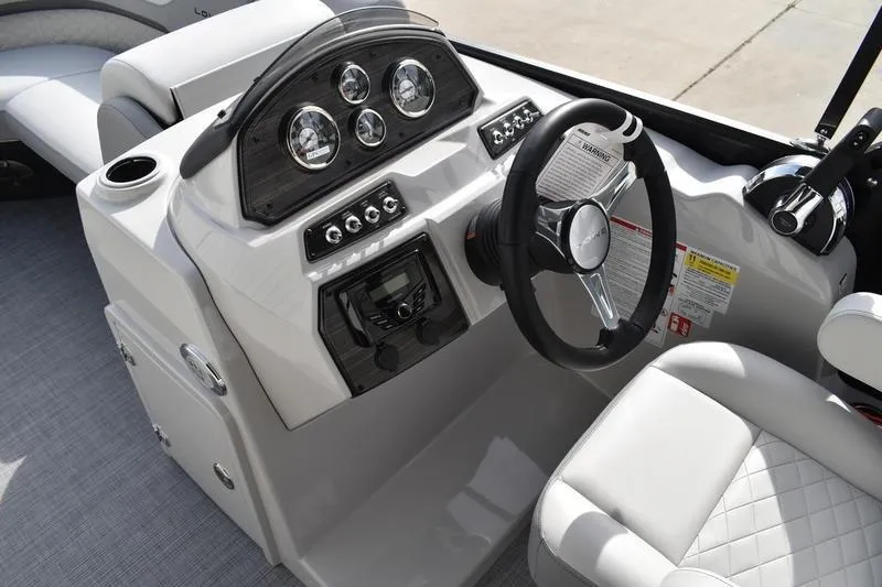 Slide: The Image of 2026 Lowe SS 210 boat dashboard with steering wheel and control panel. - 15