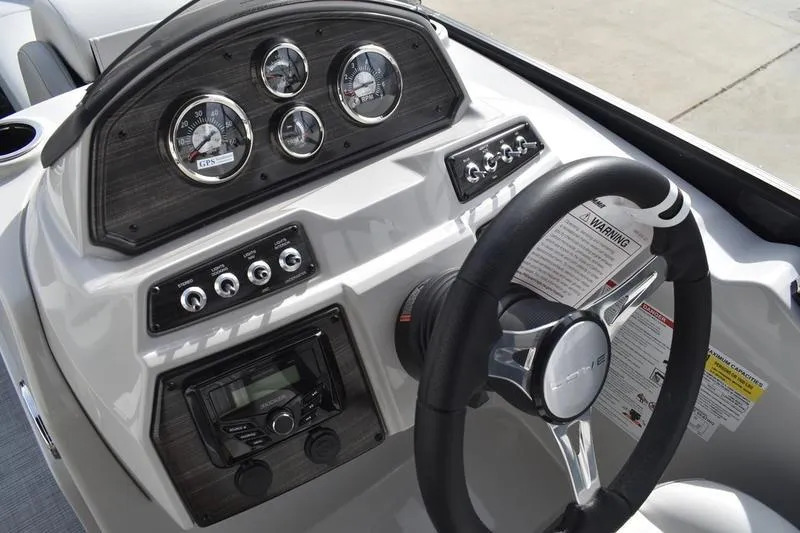 Slide: The Image of Dashboard of 2026 Lowe SS 210 boat with steering wheel and gauges. - 17