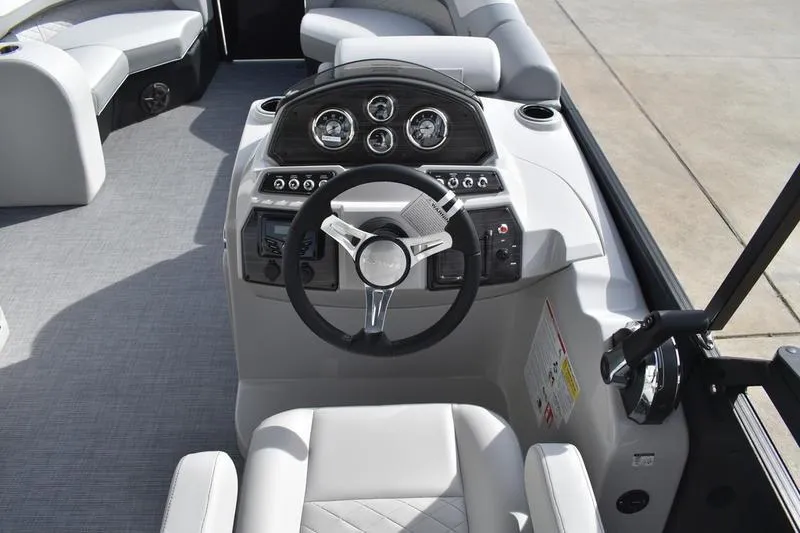 Slide: The Image of 2026 Lowe SS 210 boat interior with modern steering console and seating. - 18