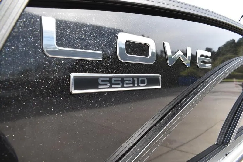 Slide: The Image of 2026 Lowe SS 210 boat logo on a sleek black surface. - 3