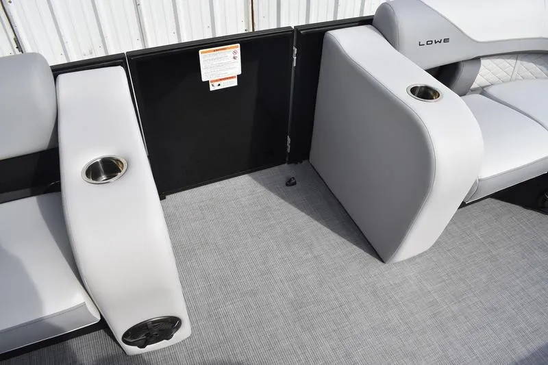 Slide: The Image of 2026 Lowe SS 210 boat interior with gray seating and cup holders. - 8
