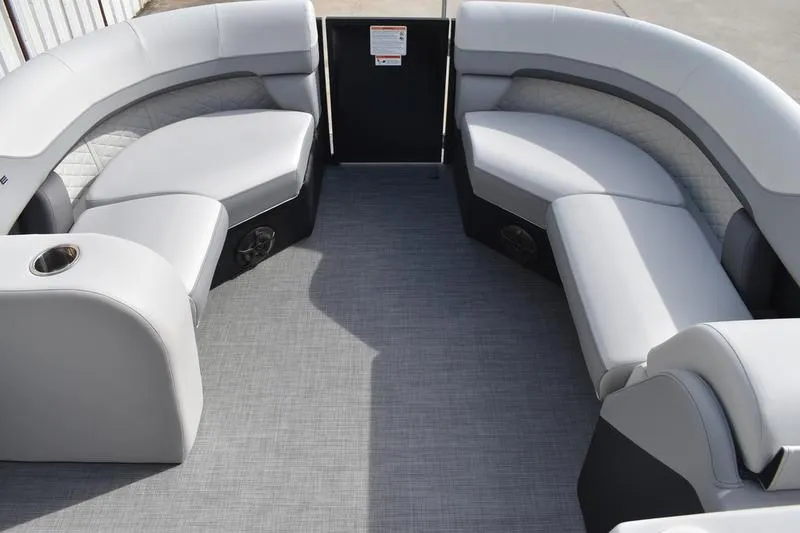 Slide: The Image of Luxurious seating area of 2026 Lowe SS 210 pontoon boat with gray upholstery. - 9