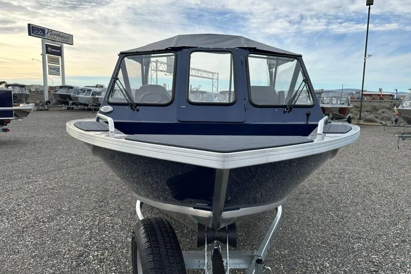 Slide: The Image of 2026 Weldcraft 200 Rebel boat on trailer at dealership lot, clear sky background. - 3