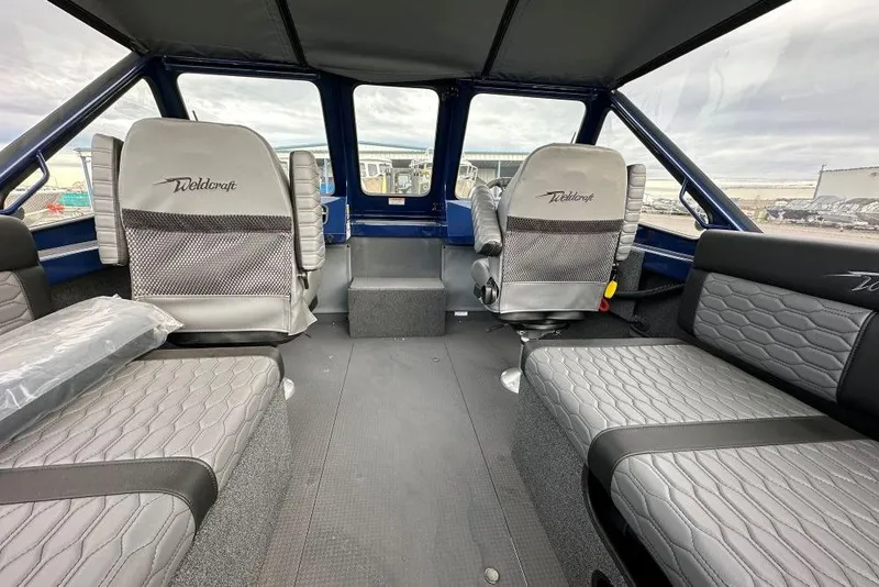 Slide: The Image of Interior of 2026 Weldcraft 200 Rebel boat with modern seating and spacious layout. - 6