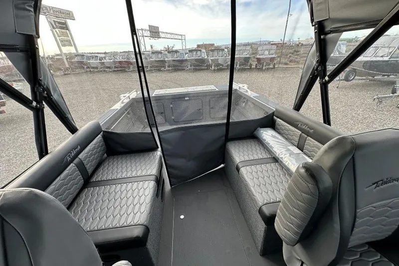 Slide: The Image of Interior of 2026 Weldcraft 200 Rebel boat with modern seating and panoramic windows. - 9