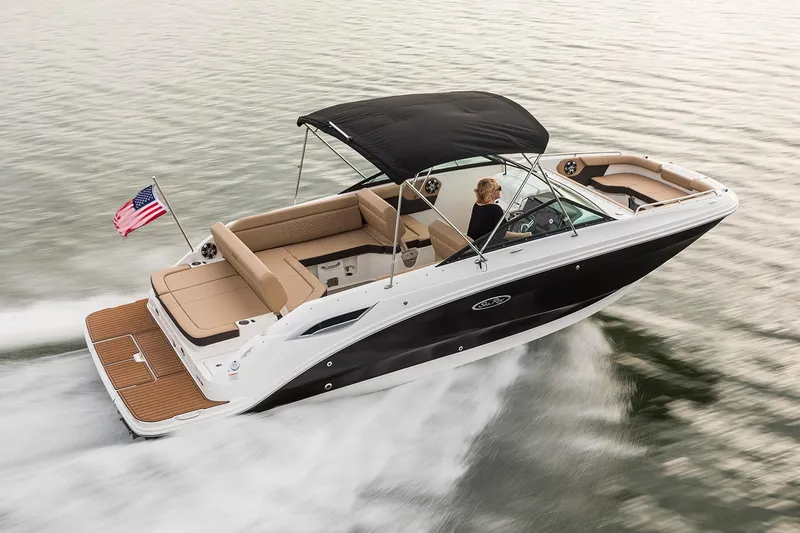 Slide: The Image of Manufacturer Provided Image: 2023 Sea Ray SDX 250 boat cruising on water with American flag. - 2