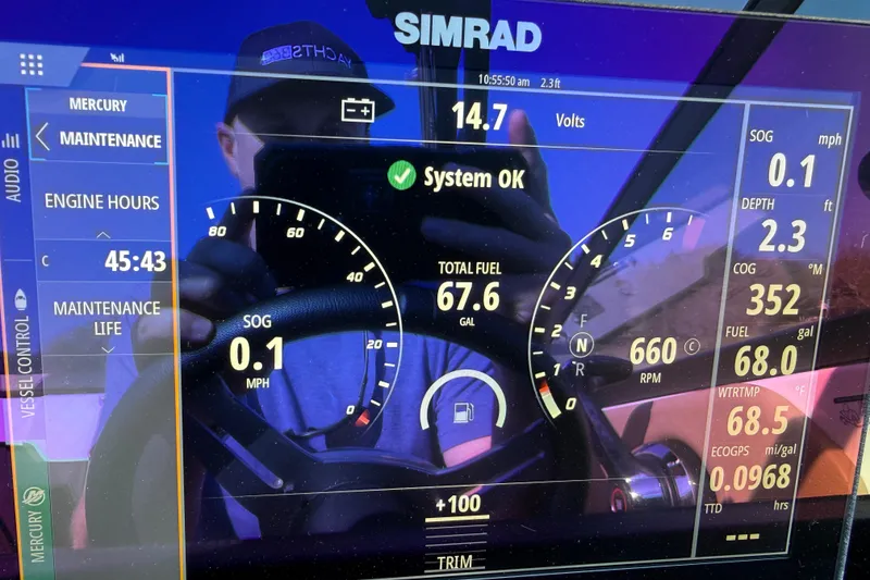 Slide: The Image of Simrad display on 2023 Sea Ray SDX 250 showing engine and fuel data. - 23